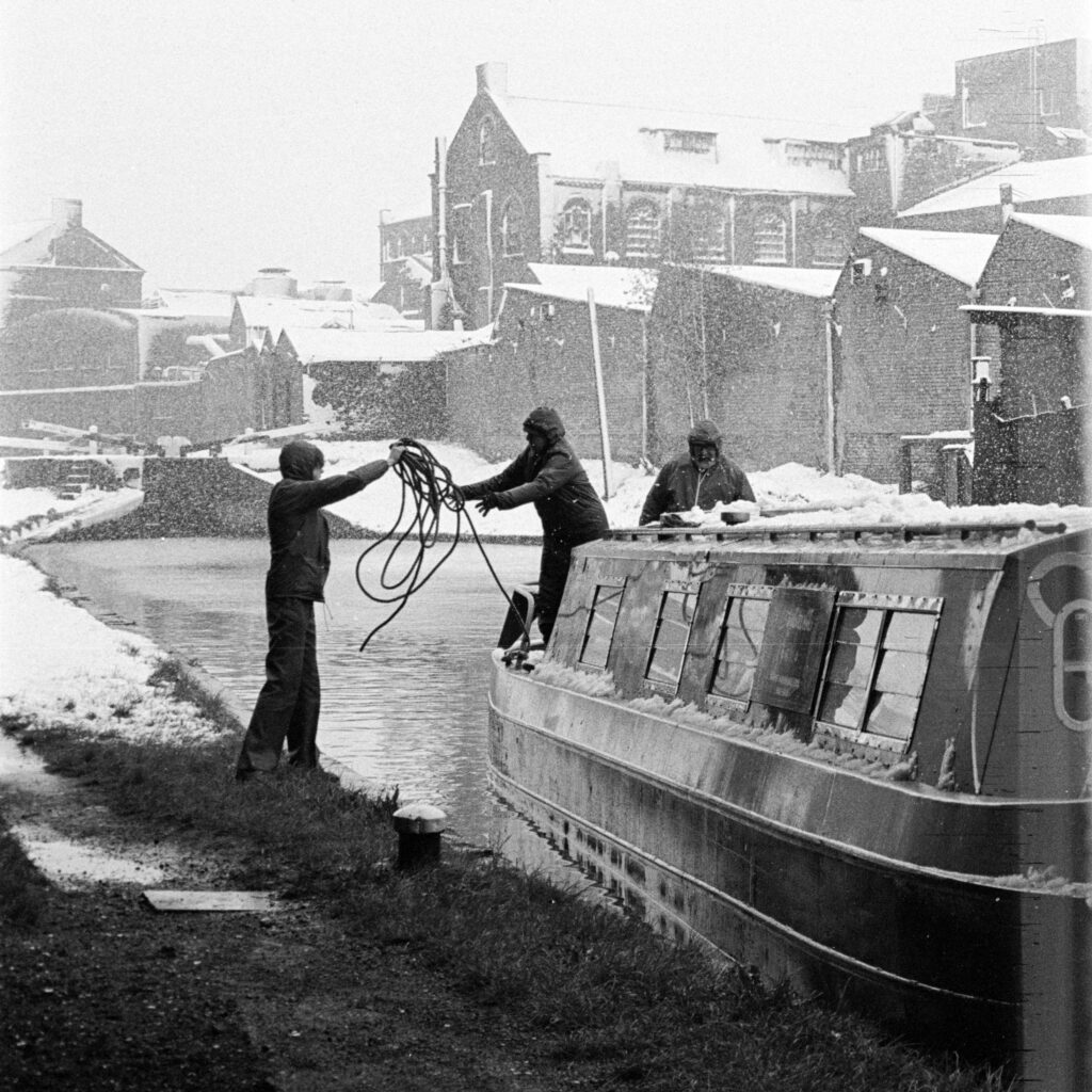 Navigating canal through Birmingham in April snow, 1981.